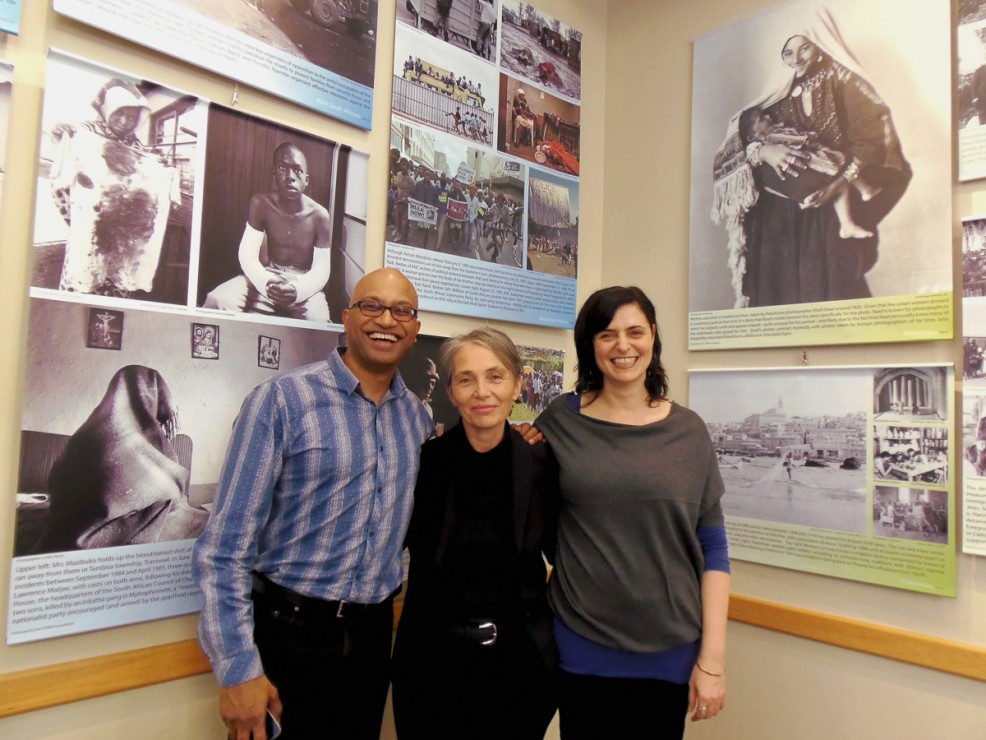 Praven Pather, Frances Everett, and Leila Durzi standing in front of the exhibit at the Cedar Hill Rec Centre cafe. —Emily Thiessen (photo)