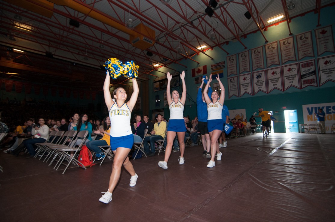 Members of the UVic Cheer Team pump up the crowd at the end of New Student Welcome on Sept. 2, 2014.