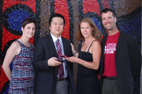 Fromleft: Lauren Shandley, Mike Yeung, Laurie Macpherson and Scott Nelson. Yeung and Nelson have made the first Bitcoin virtual currency donation to Simon Fraser University. The money will be used by Shandley and Macpherson for a humanitarian co-op project in India this fall. –Provided(photo)
