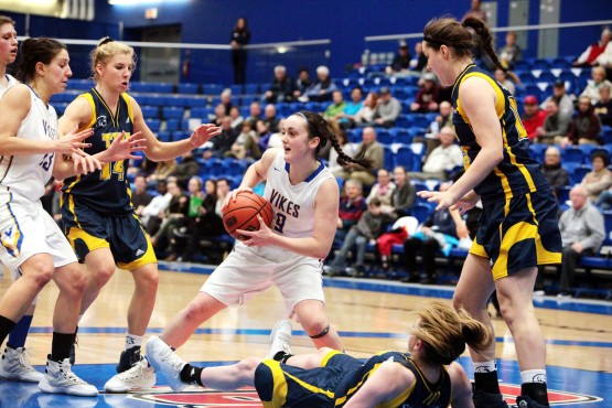 Kristy Gallagher squares off against the Trinity Western University Spartans. Photo by Neil Hodge.
