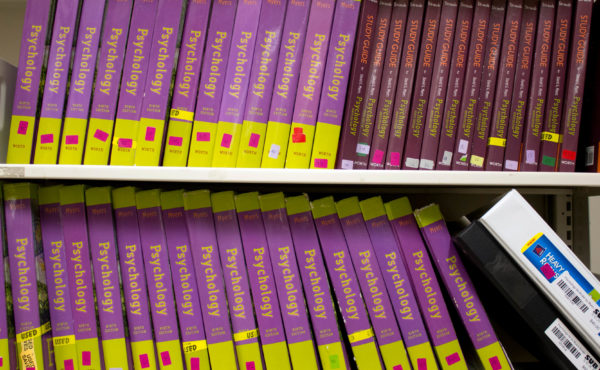 Science and psychology textbooks like these ones are out of date as soon as a new edition releases, so they're forced to sit on SUBtext's shelves. Photo by The Martlet.