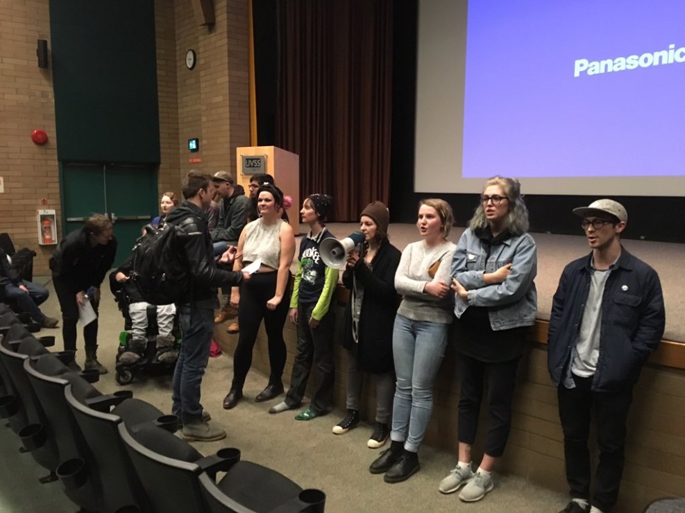 Protesters wait by the stage after demonstrating at an UVic Effective Altruism, featuring ethicist Peter Singer. Photo by Myles Sauer, Editor-in-Chief