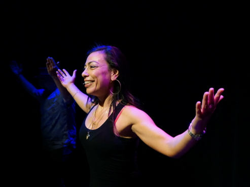 Carmen Aguirre demonstrates a salsa move for the audience of her production, 'Broken Tailbone'. Photo provided by UNO Fest