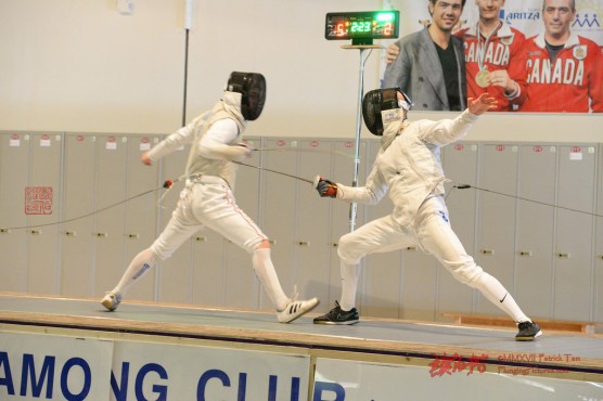 Caleb McIntosh, right, defeated Giorgi Gelashvili to win a provincial gold medal in fencing. Photo by Patrick Tam