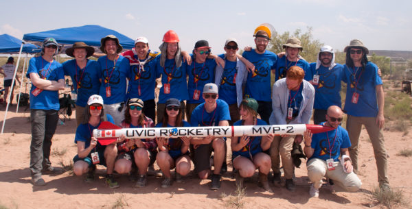 The members of UVic Rocketry who made the trip to New Mexico pose with one of their rockets. Photo provided