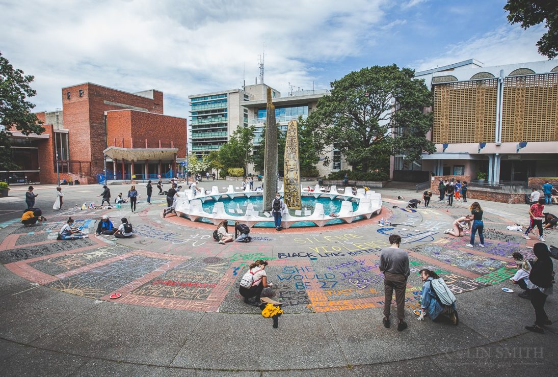 Black Lives Matter art peopleless protest, people draw chalk around centennial square