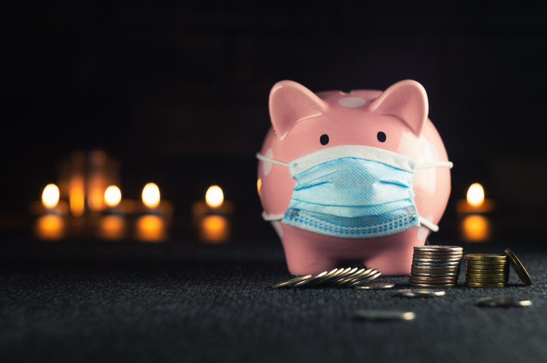Budgeting, stock photo of a piggy bank with coins and a mask