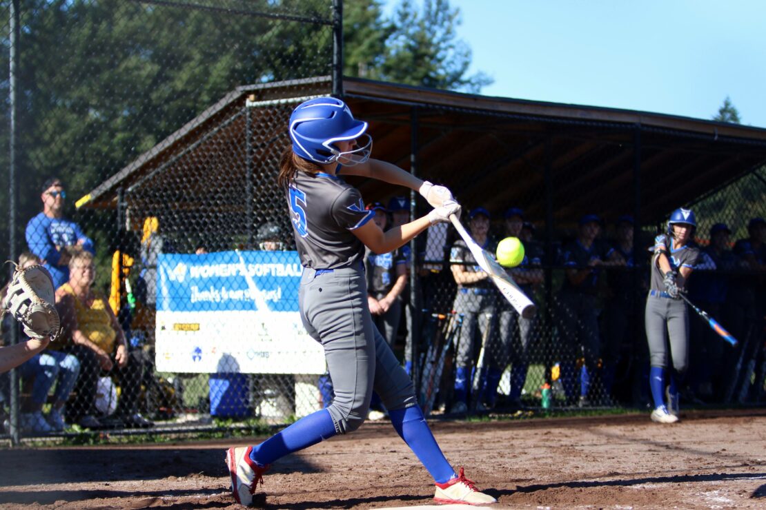 A hitter from the UVic Vikes women's softball team. Photo by Captured Sports Photography,