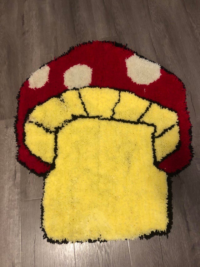 A mushroom-shaped tufted rug, rug and photo by Atum Beckett.