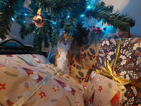 Wrapped presents under a tree, photo by Sie Douglas-Fish.