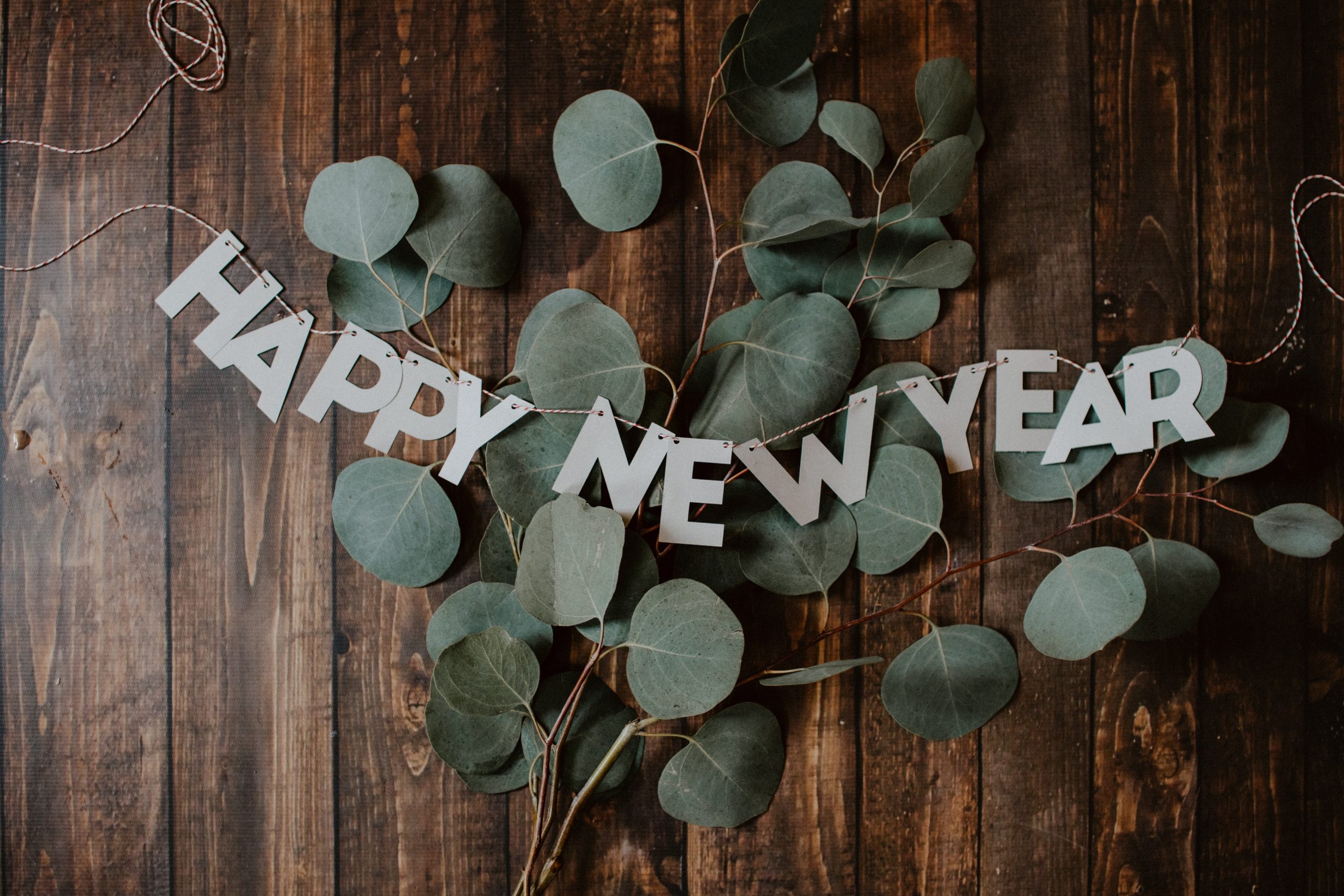 A Happy New Years sign, photo by Kelly Sikkema via Unsplash.