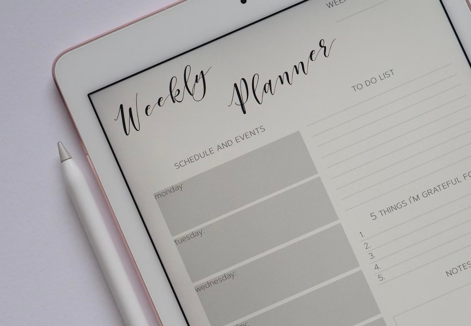 A weekly planner, photo by Jess Bailey via Unsplash.