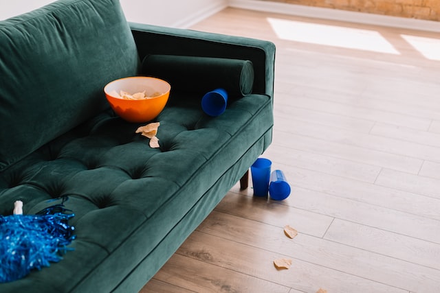 A couch with discarded popcorn. Photo by Phillip Goldsberry via Unsplash.