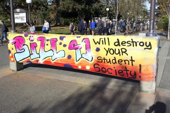 On Nov. 2, two banners protesting Bill 41 were put up outside the SUB and Petch Fountain; on Nov. 3, this one had been ripped apart by unknown individuals. Photo by Myles Sauer
