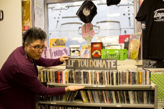 Native Waves host Janet Rogers shows off CFUV's House of Swag. Photo by William Workman (Production Co-ordinator)