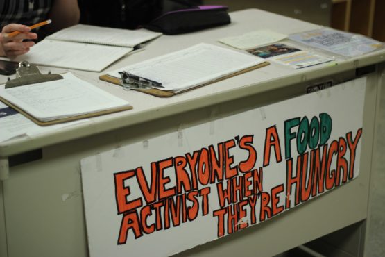 A sign that reads "Everyone's a food activist when they're hungry"