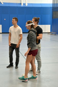 Lindsay Webster (left) and Radek Wiechecki (back right) guide a volunteer at orientation. Photo by Anna Wortberg