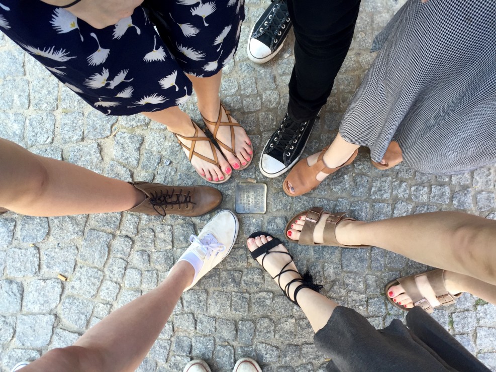 A stolperstein (or stumbling stone) placed in the street. Photo by Riley van der Linden