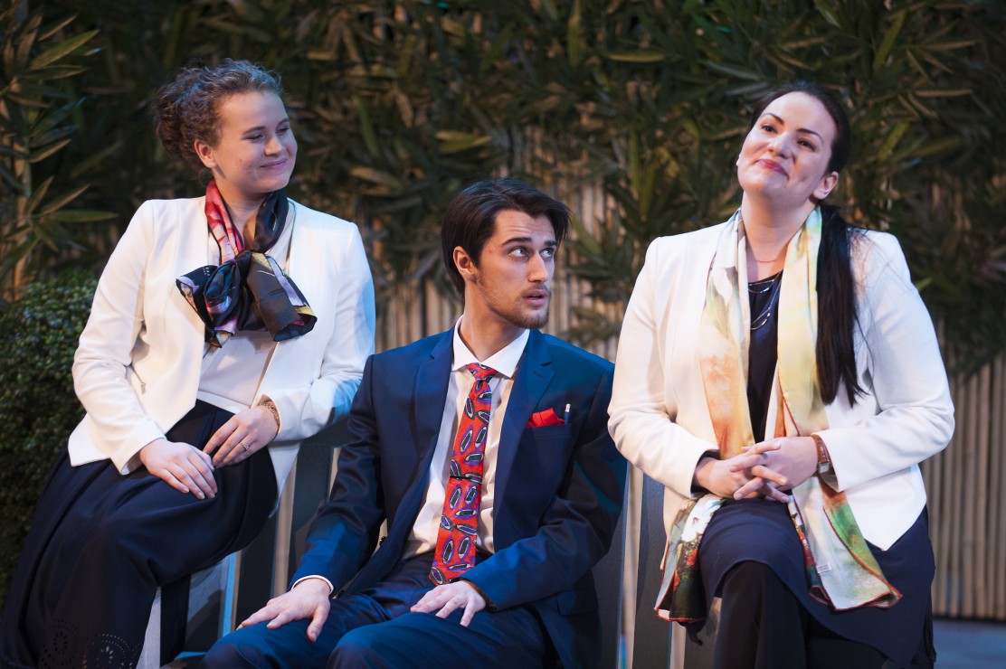 Dr. Tina Makeshift and Dr. Christine Stichbody (Emma Leck and Jessie Johnston) regale Sidney Riley Best (Nicholas Guerreiro), the man they believe is the government inspector. Photo by David Lowes