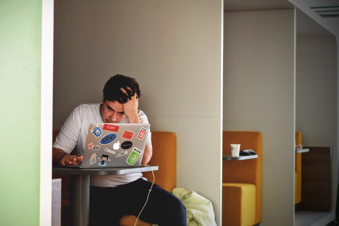 A student sits at a desk in university