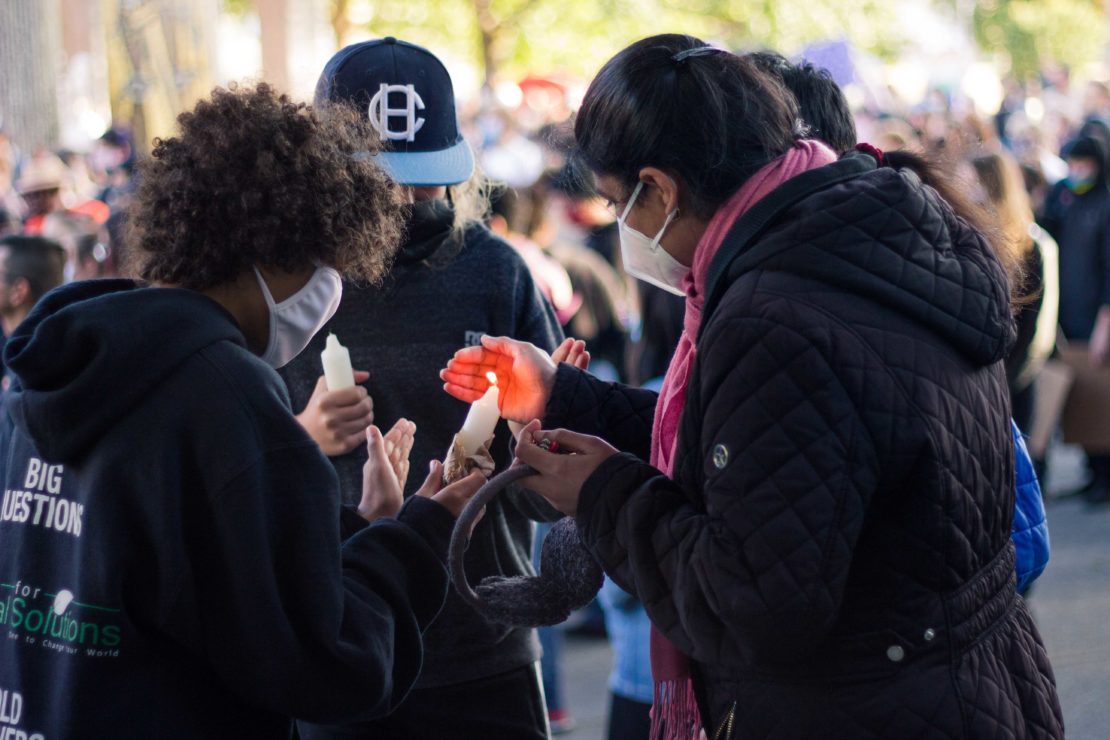 Black Lives Matter peace rally, protesters light candle for George Floyd