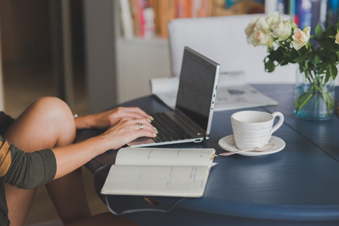 Photo of a women working on a laptop