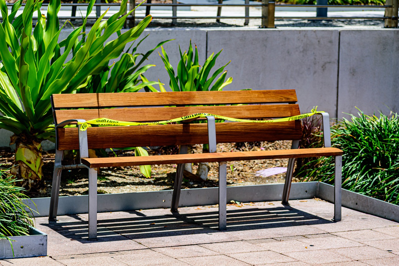 park bench in green space COVID-19